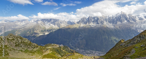View on Chamonix around snowy mountains and clouds