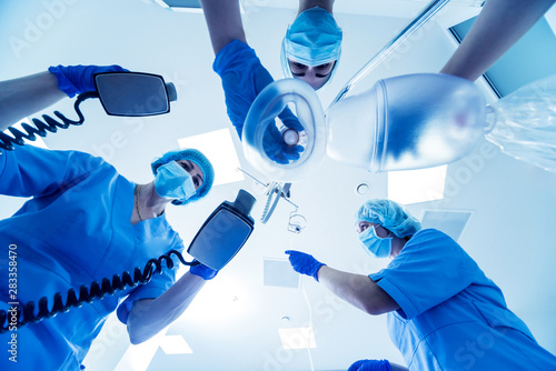 Doctors give resuscitation to a male patient in the emergency room. Cardiac massage