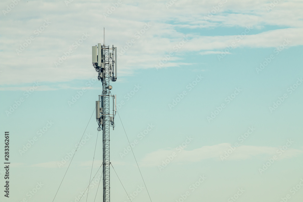 Mobile phone communication antenna tower with the blue sky and clouds, Telecommunication tower Mobile phone communication antenna tower with the blue sky and clouds, Telecommunication tower