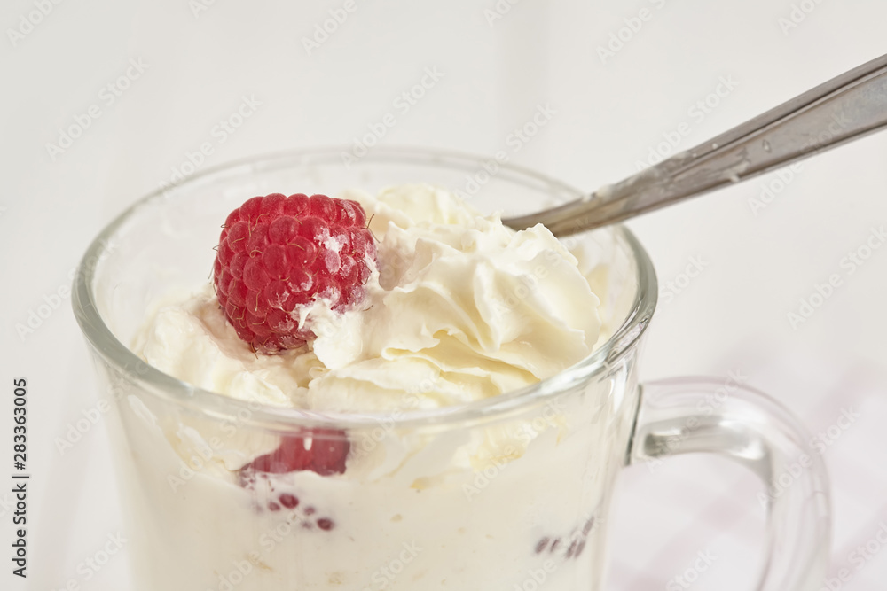 Whipped cream with fresh berry. Close up Whipped cream with fresh berry. Close up