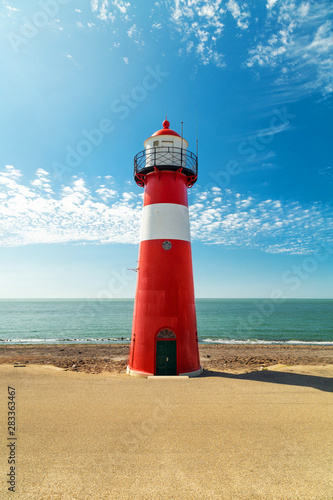 Red and white Lighthouse North Head, Westkapelle, Netherlands