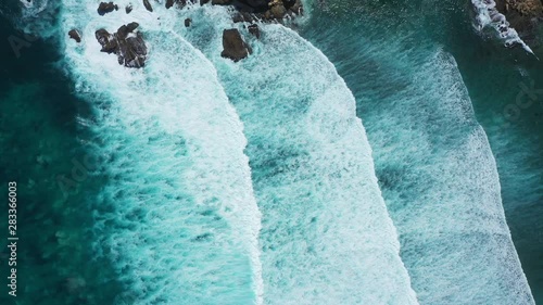Waves breaking over a reef from above
