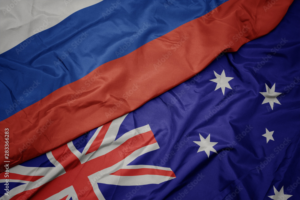 waving colorful flag of australia and national flag of russia. waving colorful flag of australia and national flag of russia.