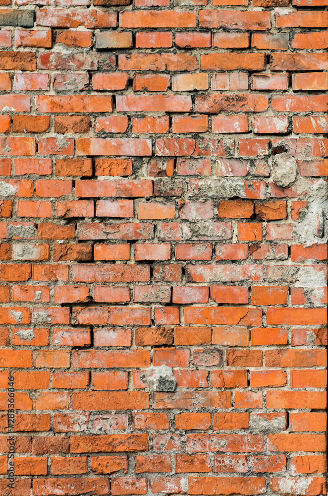 Obraz premium weathered red brick wall background