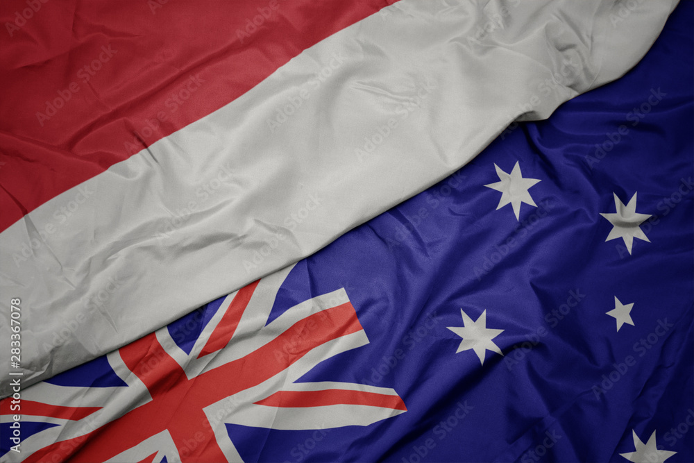 waving colorful flag of australia and national flag of indonesia. waving colorful flag of australia and national flag of indonesia.