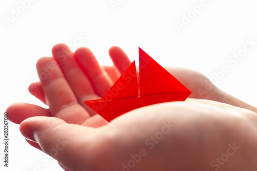 The ship in the hands. Pape...