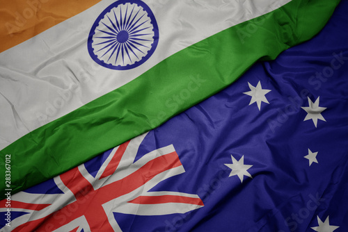 Photography waving colorful flag of australia and national flag of india.