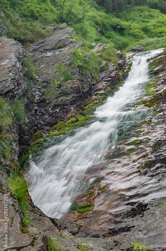 Waterfall in Tatra mountain range in Polish Carpathian Mountains