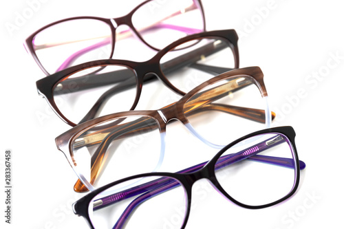 Four pairs of plastic fashionable eyeglass frames. Isolated