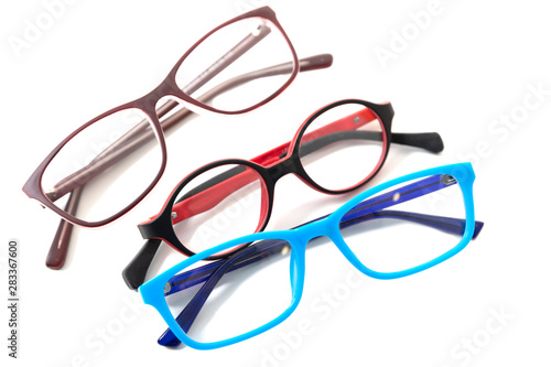 Three pairs of colorful children's glasses. Isolated