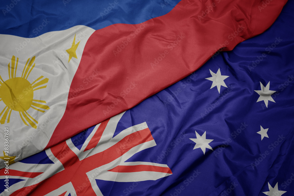 waving colorful flag of australia and national flag of philippines. waving colorful flag of australia and national flag of philippines.