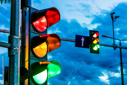 Traffic lights over urban intersection photo