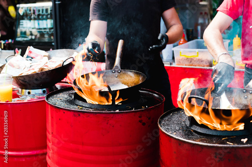 Cooking food in pans at a street festival