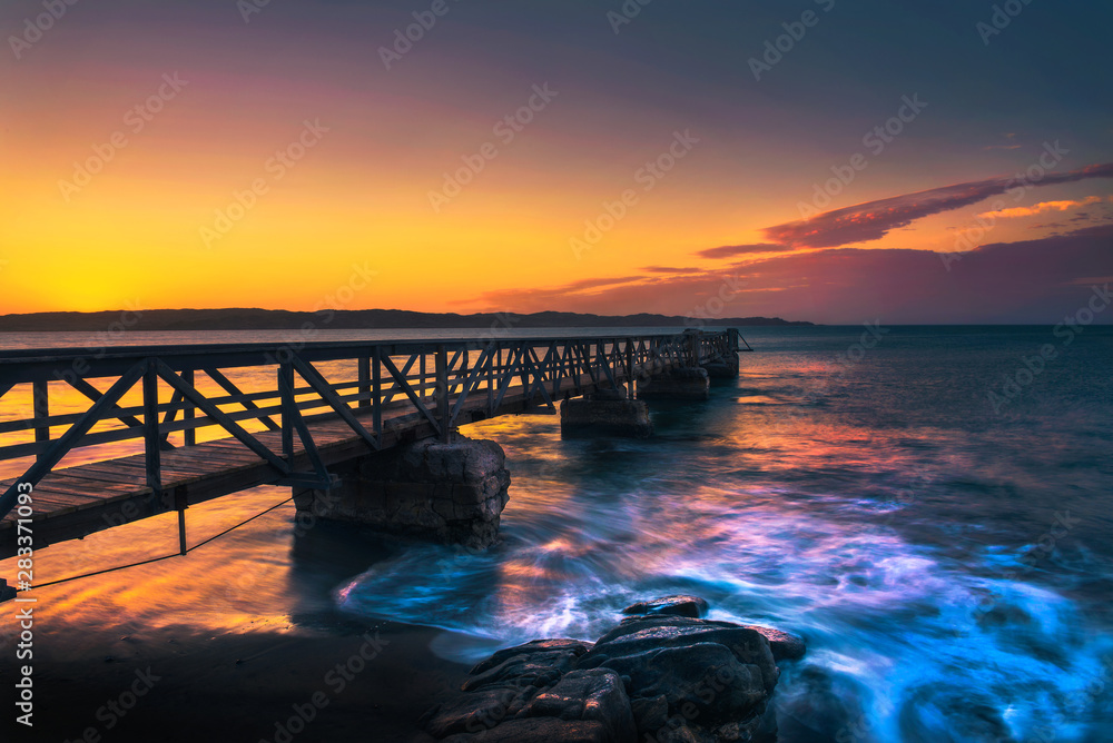 Pier in the harbour town of Luderitz at sunset in southwest Namibia