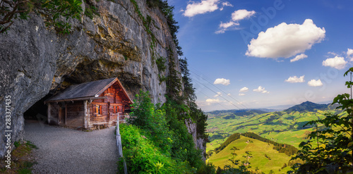 Historic cabin in the Wildkirchli cave in the Appenzell region of Switzerland photo
