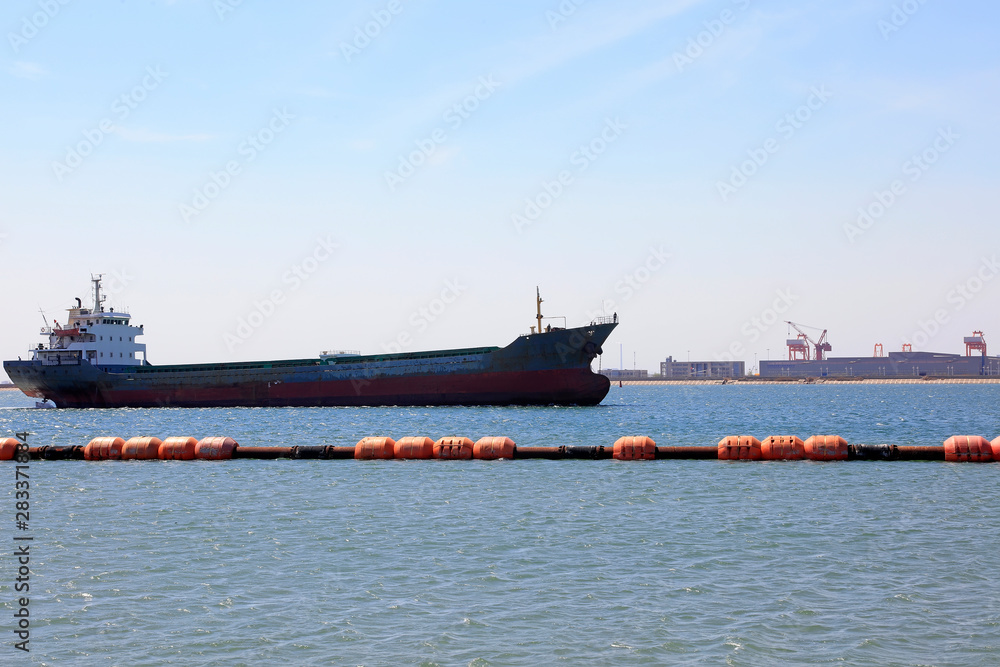 Cargo ships and dredging steel buoy
