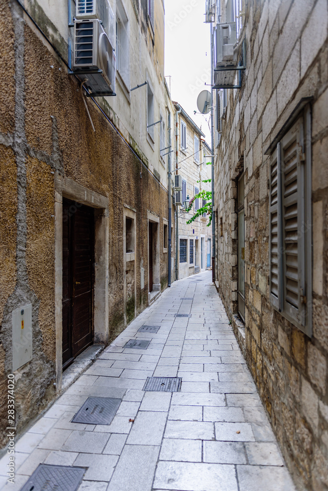 Omis old town. Traditional narrow street with stone houses, Dalmatia region, Croatia