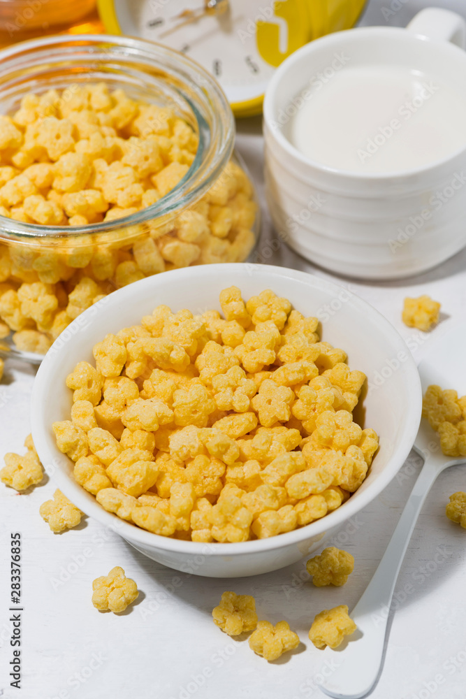breakfast cereal for children - crispy stars on white table, vertical closeup breakfast cereal for children - crispy stars on white table, vertical closeup