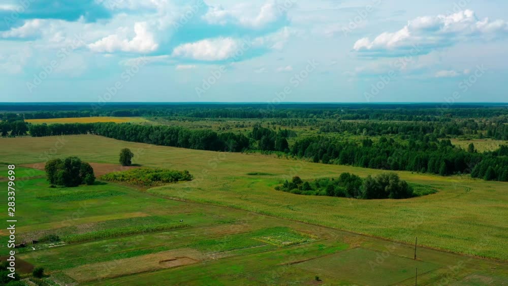 4K Drone. Aerial view of Desna, an urban-type settlement in Kozelets Raion, Chernihiv Oblast in northern Ukraine. Shot on a bright summer day with blue sky and few clouds. 4K Drone. Aerial view of Desna, an urban-type settlement in Kozelets Raion, Chernihiv Oblast in northern Ukraine. Shot on a bright summer day with blue sky and few clouds.