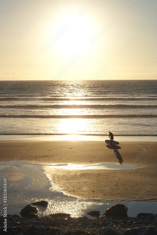 Surfer in sunset