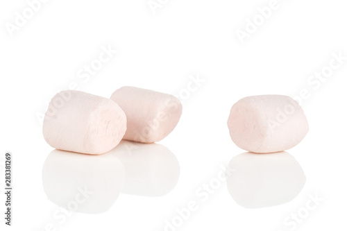 Group of three whole sweet fluffy marshmallow isolated on white background