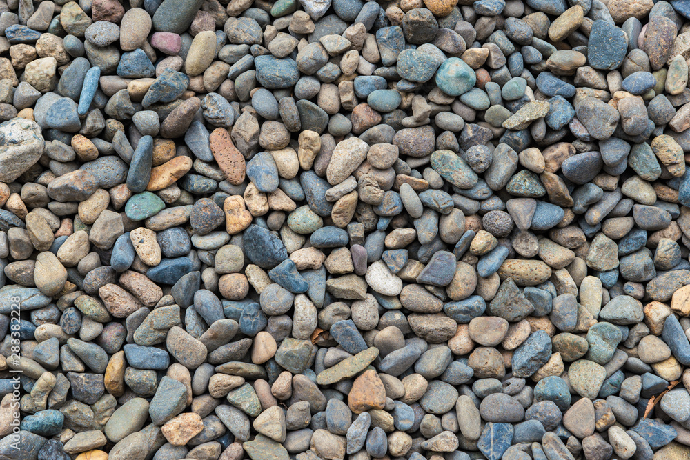 Multicolor stone pebbles ground as background Multicolor stone pebbles ground as background