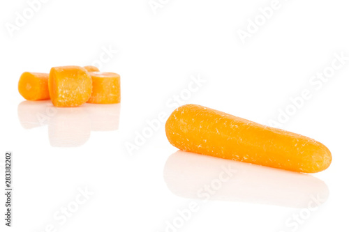Group of one whole four quarters of stale  orange stale baby carrot baby isolated on white background
