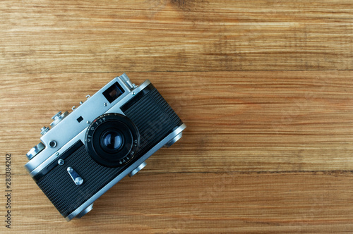 vintage camera on wooden background