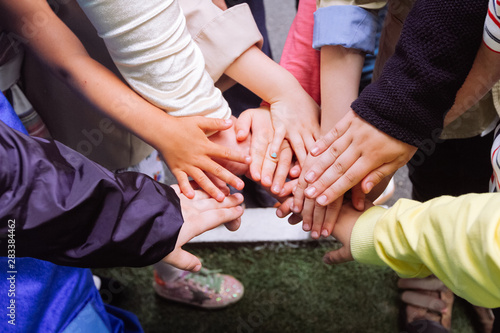 Close up of children keeping hands together