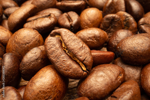 Very big roasted brown coffee beans background