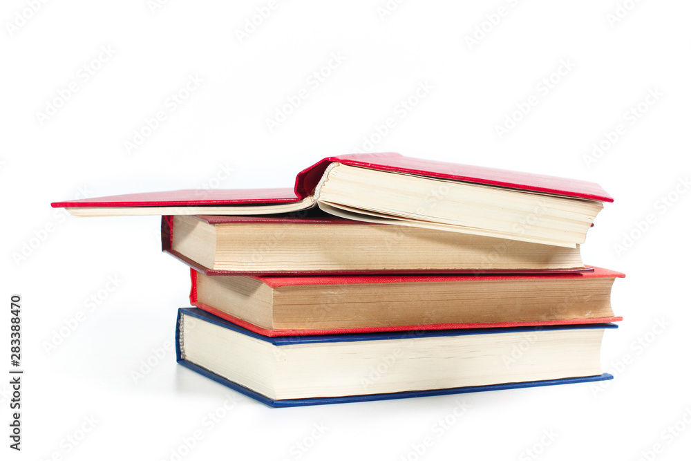 Stack of books, close-up on a white background. The concept of science and education. Stack of books, close-up on a white background. The concept of science and education.