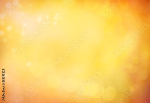 Blurred abstract autumn background. Autumn foliage effect. Glitter golden bok...