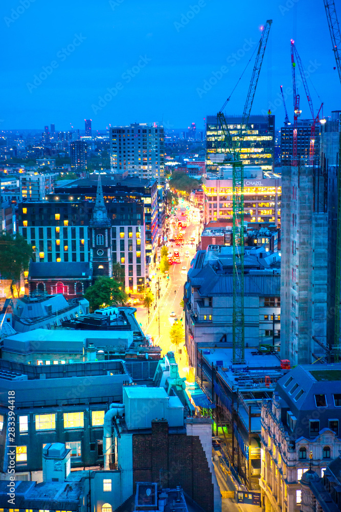 Obraz premium London, UK. City of London at night with lots office buildings lights. View from roof garden at the west part of the City