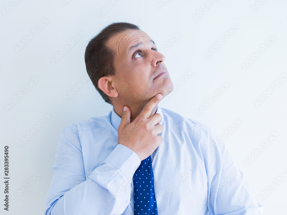Middle age man thinking clueless about a question Middle age man thinking clueless about a question