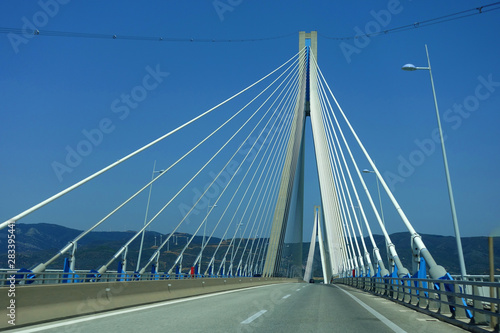 Driving through famous modern anti seismic cable bridge of Rio Antirio Harilaos Trikoupis that connects Peloponnese to mainland Greece