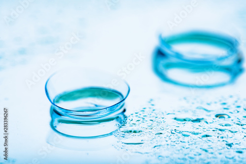Two contact lenses with reflections....