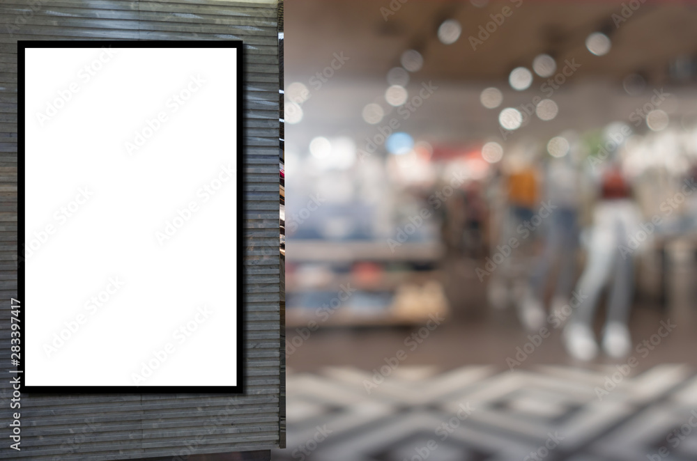 blank showcase billboard or advertising light box for your text message or media content with blurred image popular women fashion clothes shop showcase in shopping mall, commercial, marketing concept
