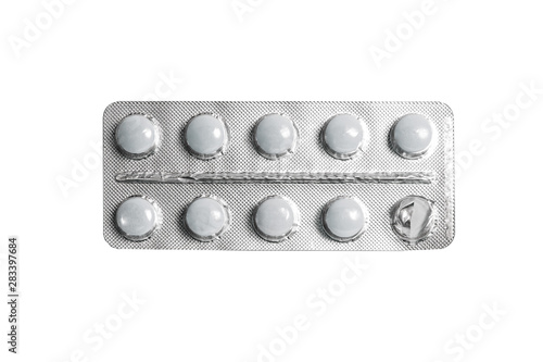 Fotografie Blister pack of white pills isolated on a white background