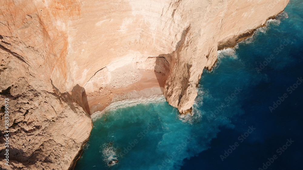 Aerial drone view of iconic beach of Navagio or Shipwreck voted one of the most beautiful beaches in the world with deep turquoise clear sea, Zakynthos island, Ionian, Greece Aerial drone view of iconic beach of Navagio or Shipwreck voted one of the most beautiful beaches in the world with deep turquoise clear sea, Zakynthos island, Ionian, Greece