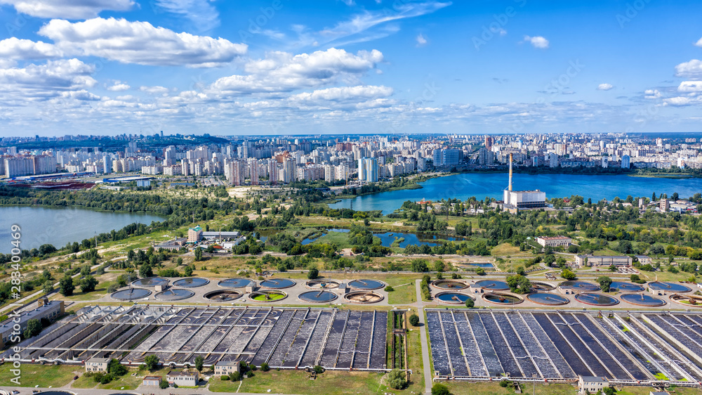 Wastewater Treatment Plant including grit chamber, basins, clarifiers, aeration - drone look-down aerial crab shot