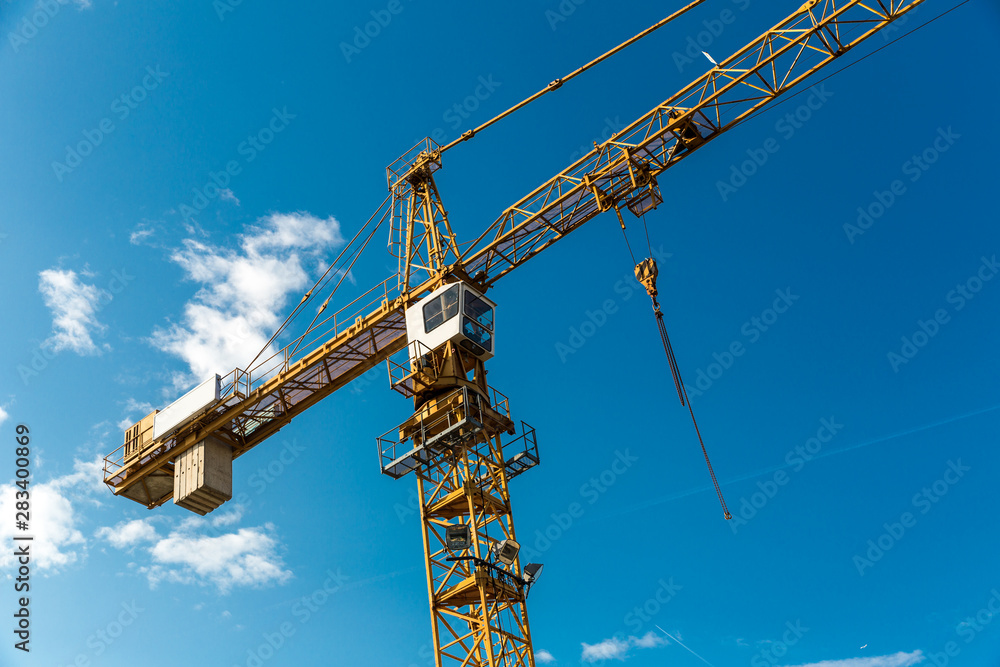 Construction site in european city, tower crane Construction site in european city, tower crane