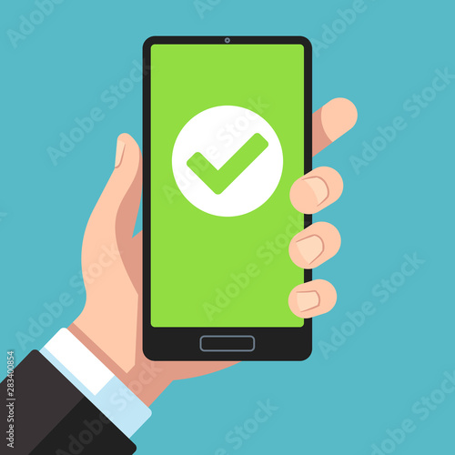 Checkmark on smartphone screen. Hand holding smartphone with green tick. Phone surveys technology, website app testing vector concept