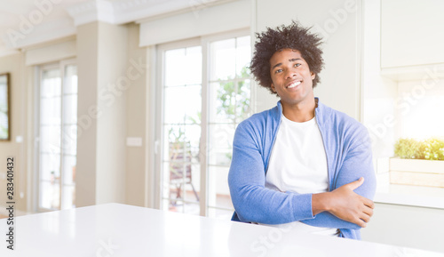 African American man at home happy face smiling with crossed arms looking at the camera. Positive person. © Krakenimages.com