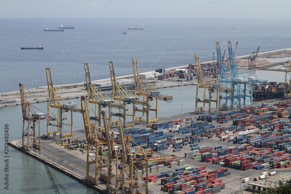 Harbour of Barcelona, Spain, with freight contenairs and Cranes. cranes