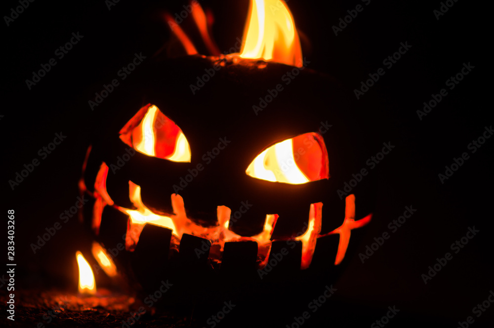 green watermelon burns with fiery flame on the scary holiday of october halloween green watermelon burns with fiery flame on the scary holiday of october halloween