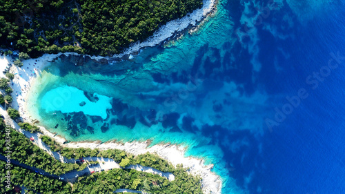 Fototapeta Naklejka Na Ścianę i Meble -  Aerial drone top view photo of exotic paradise beach of Emblisi with turquoise and emerald clear sea near iconic Fiskardo bay, Cefalonia island, Ionian, Greece