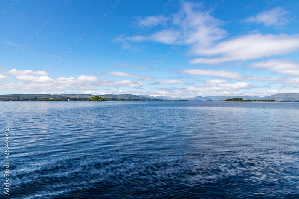 Lough Corrib with forest and Conerama mountains in background