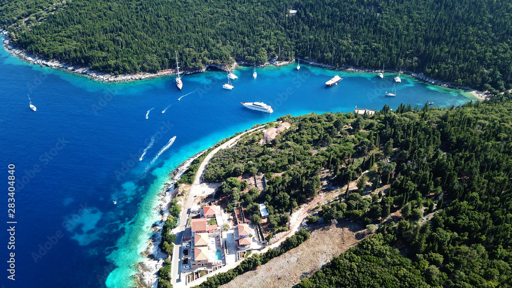 Aerial drone photo of picturesque and iconic port of Fiskardo with luxury boats docked and traditional character, Cefalonia island, Ionian, Greece
