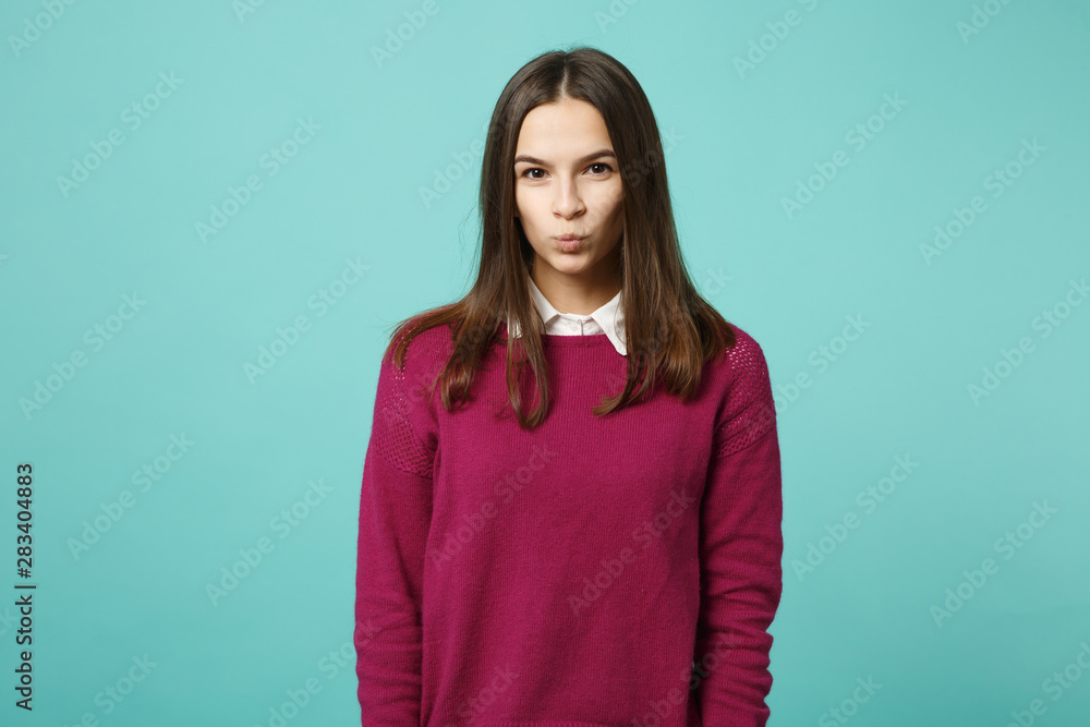 Young brunette woman girl in casual clothes posing isolated on blue wall background studio portrait. People sincere emotions lifestyle concept. Mock up copy space. Looking camera blow send air kiss. Young brunette woman girl in casual clothes posing isolated on blue wall background studio portrait. People sincere emotions lifestyle concept. Mock up copy space. Looking camera blow send air kiss.