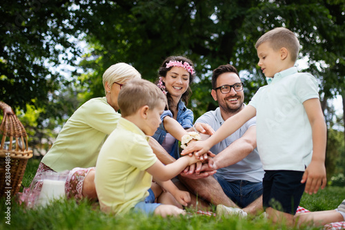 Family picnic outdoors togetherness relaxation happiness concept
